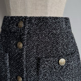 Jupe boutonnée en tweed pailleté